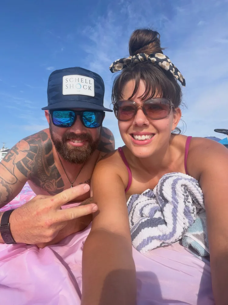Bryant and Sarah smiling together on a sunny day