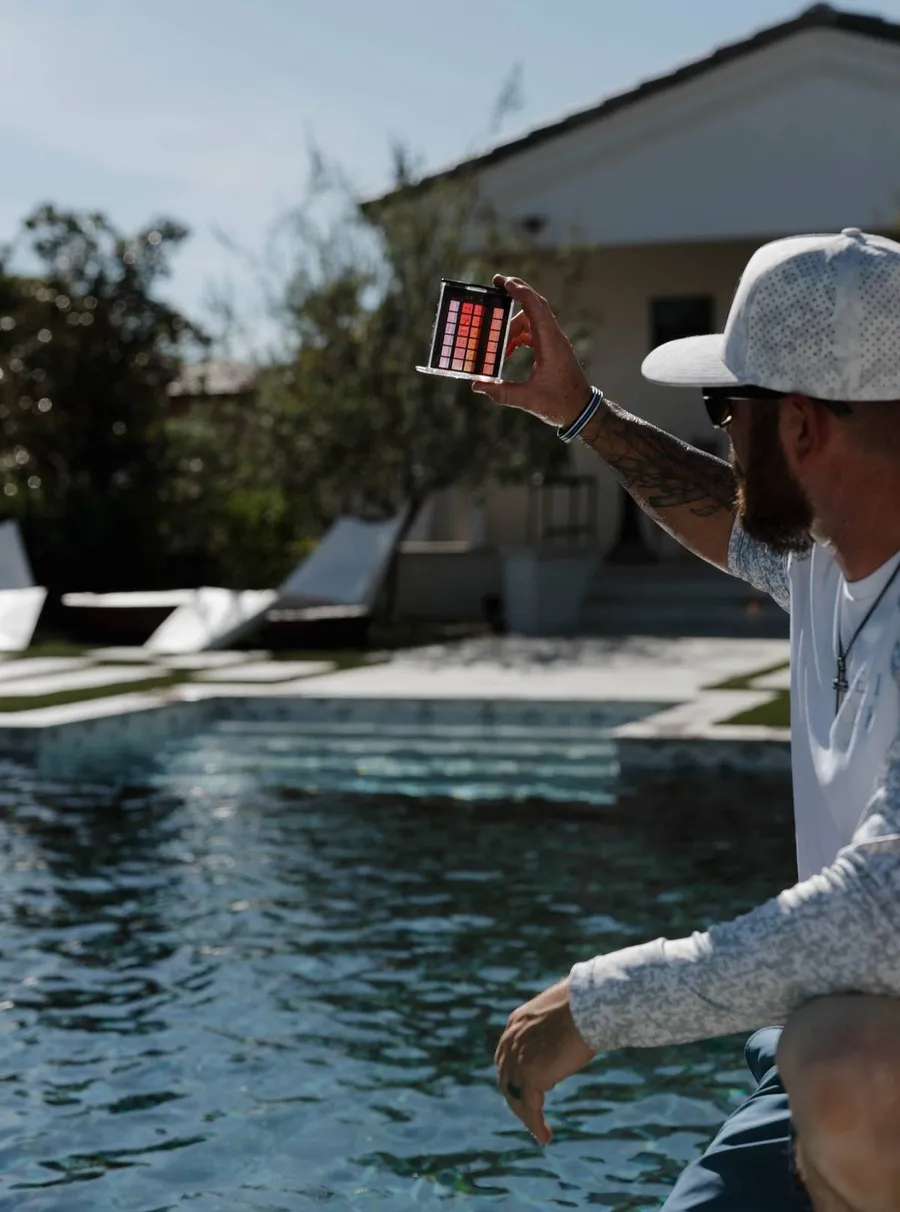 Bryant Schell checking pool water test results